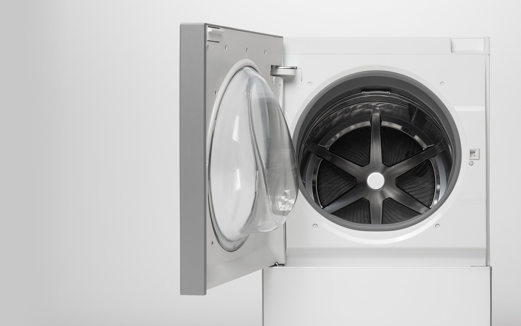 Front view of a washing machine with its door open, exposing the drum and control panel against a plain white background