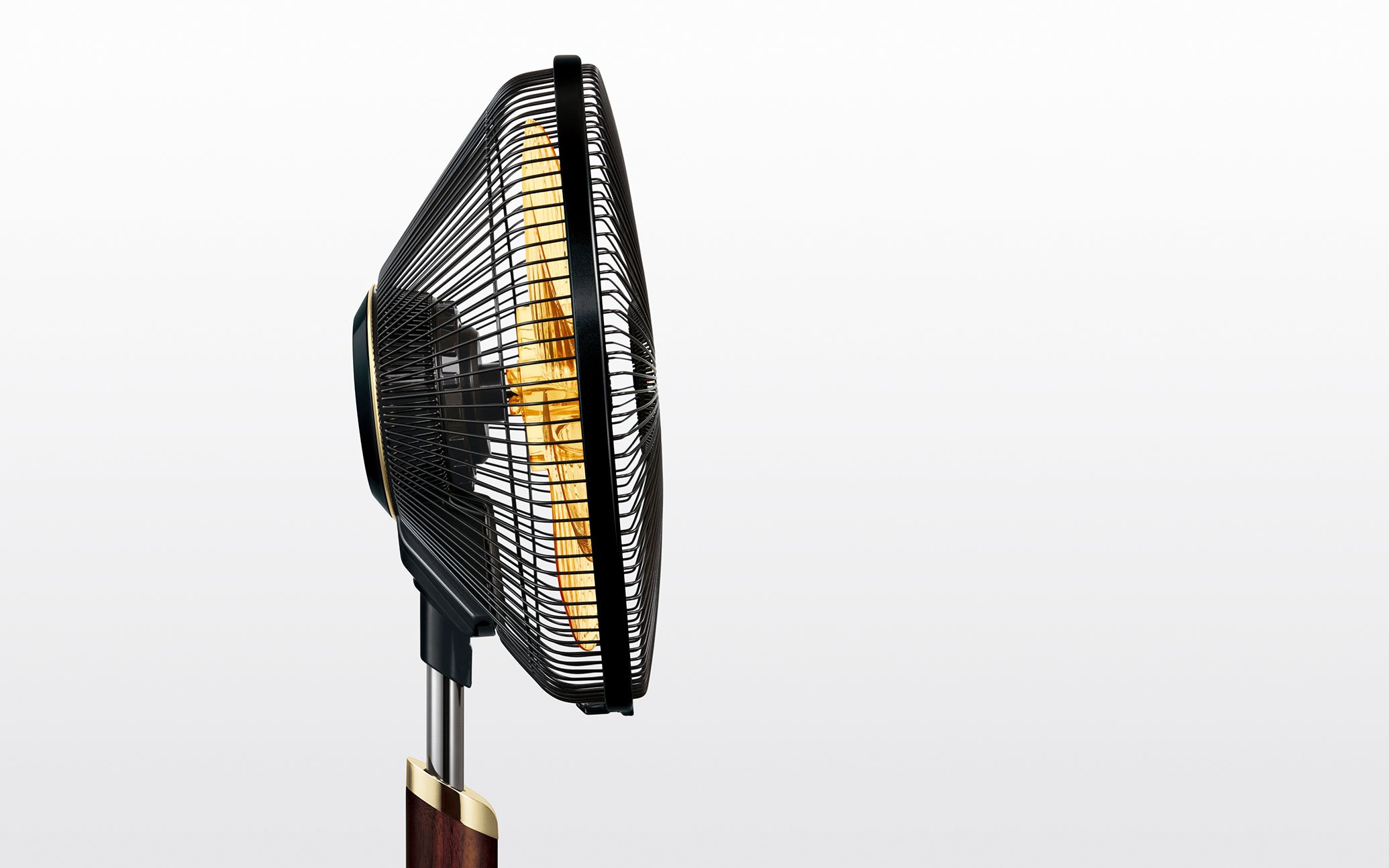 A side view of a black oscillating fan with protective grille and wooden base, set against a plain background.