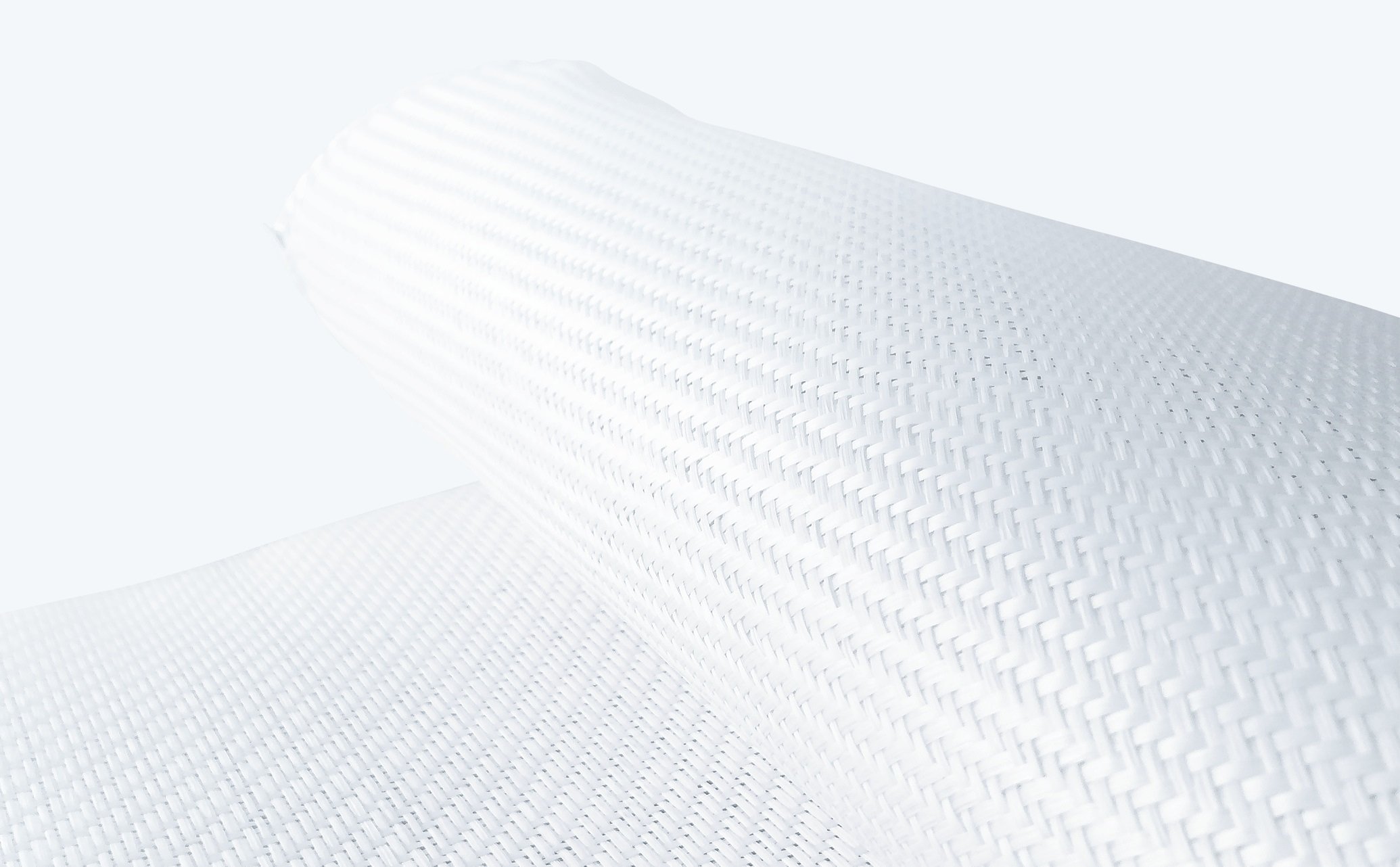 Close-up of two white woven fabric rolls with a tight, textured pattern against a light background