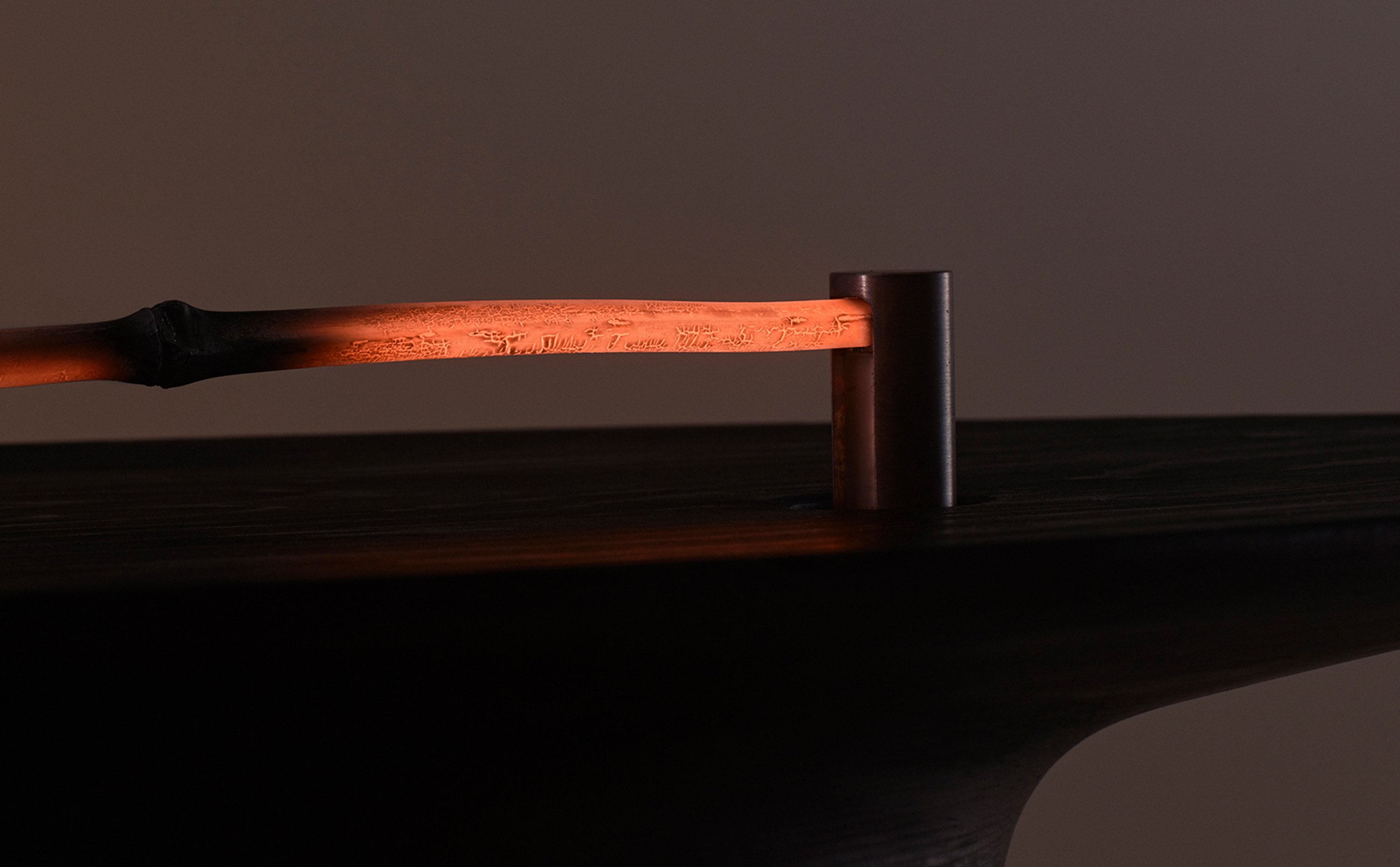 The glowing red coals.