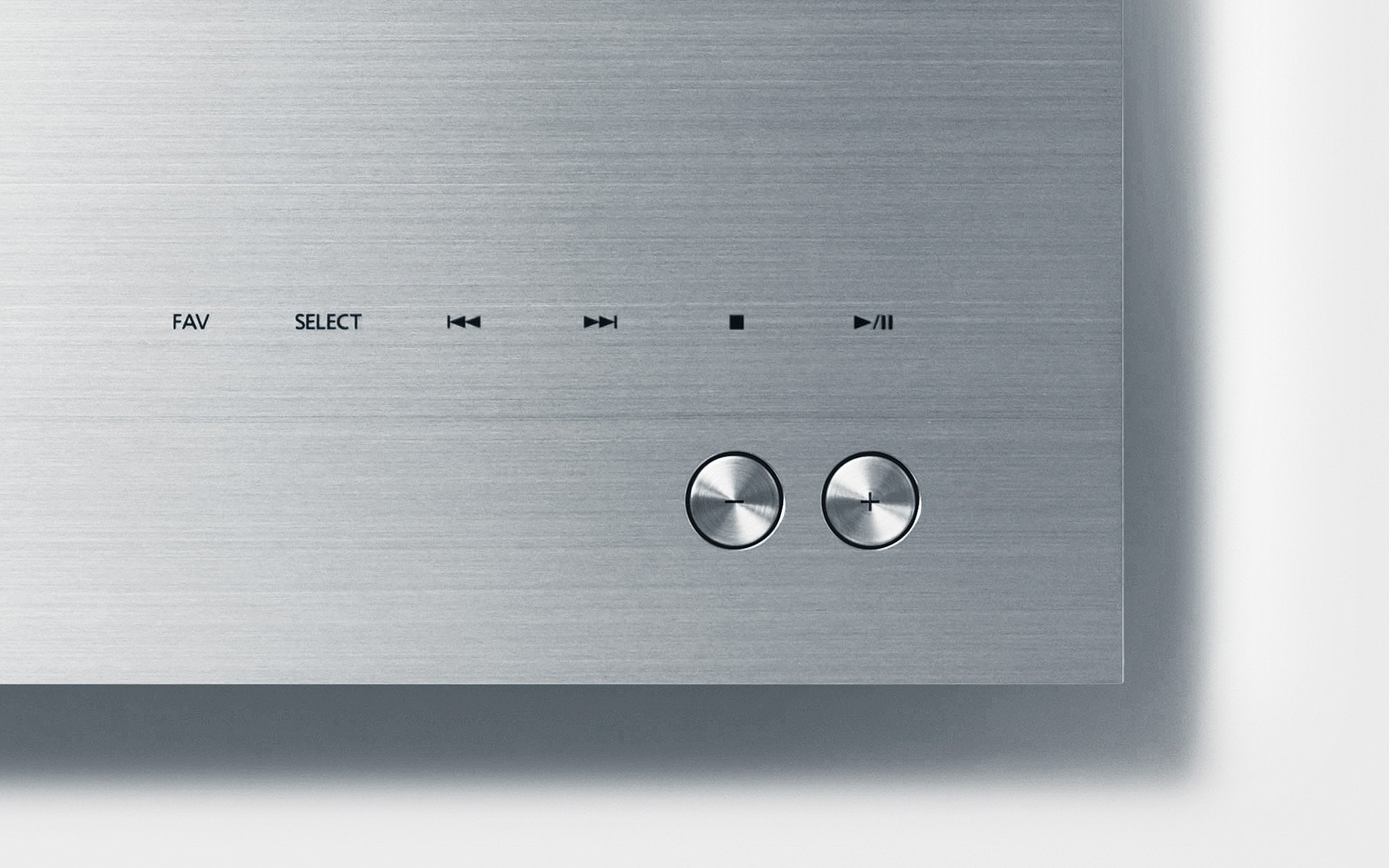 Metal surface with control buttons for playback and text display