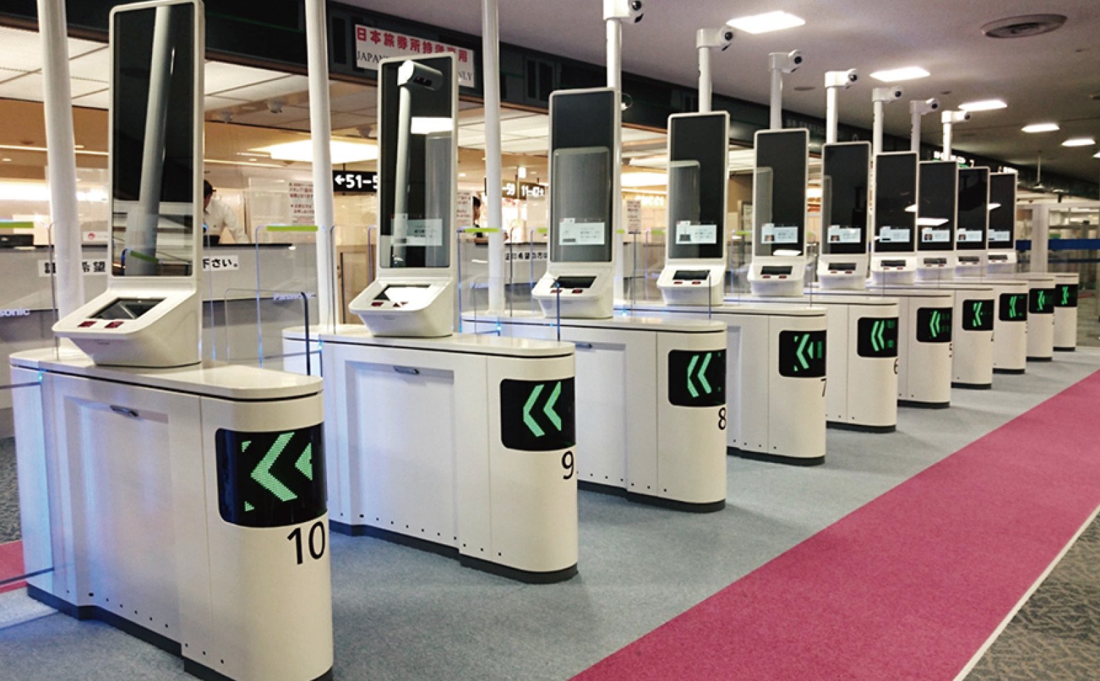 Airport obtainment country control gates with face recognition gates alongside.