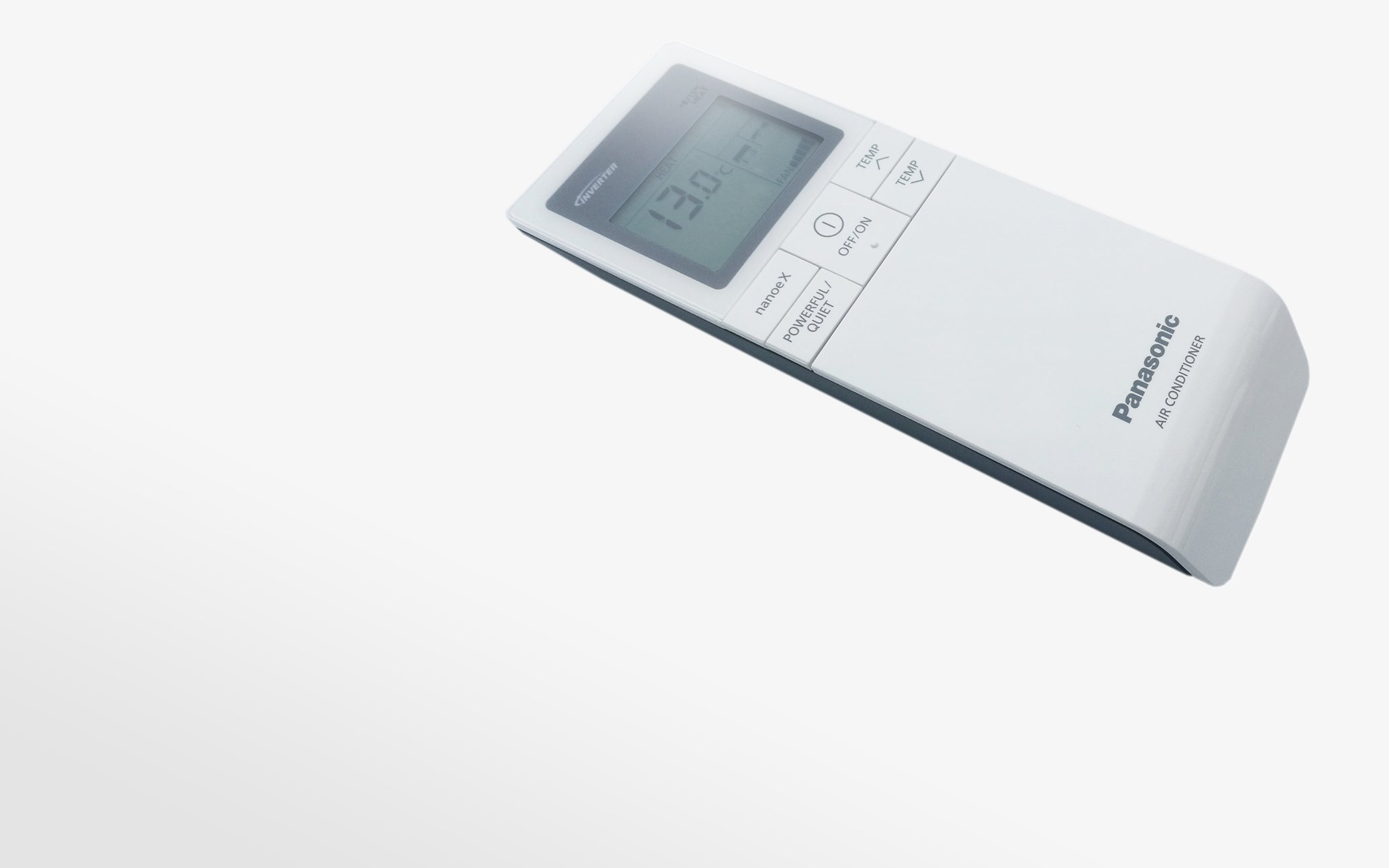 Close-up of a white floor-standing air conditioner remote control with LCD screen and buttons