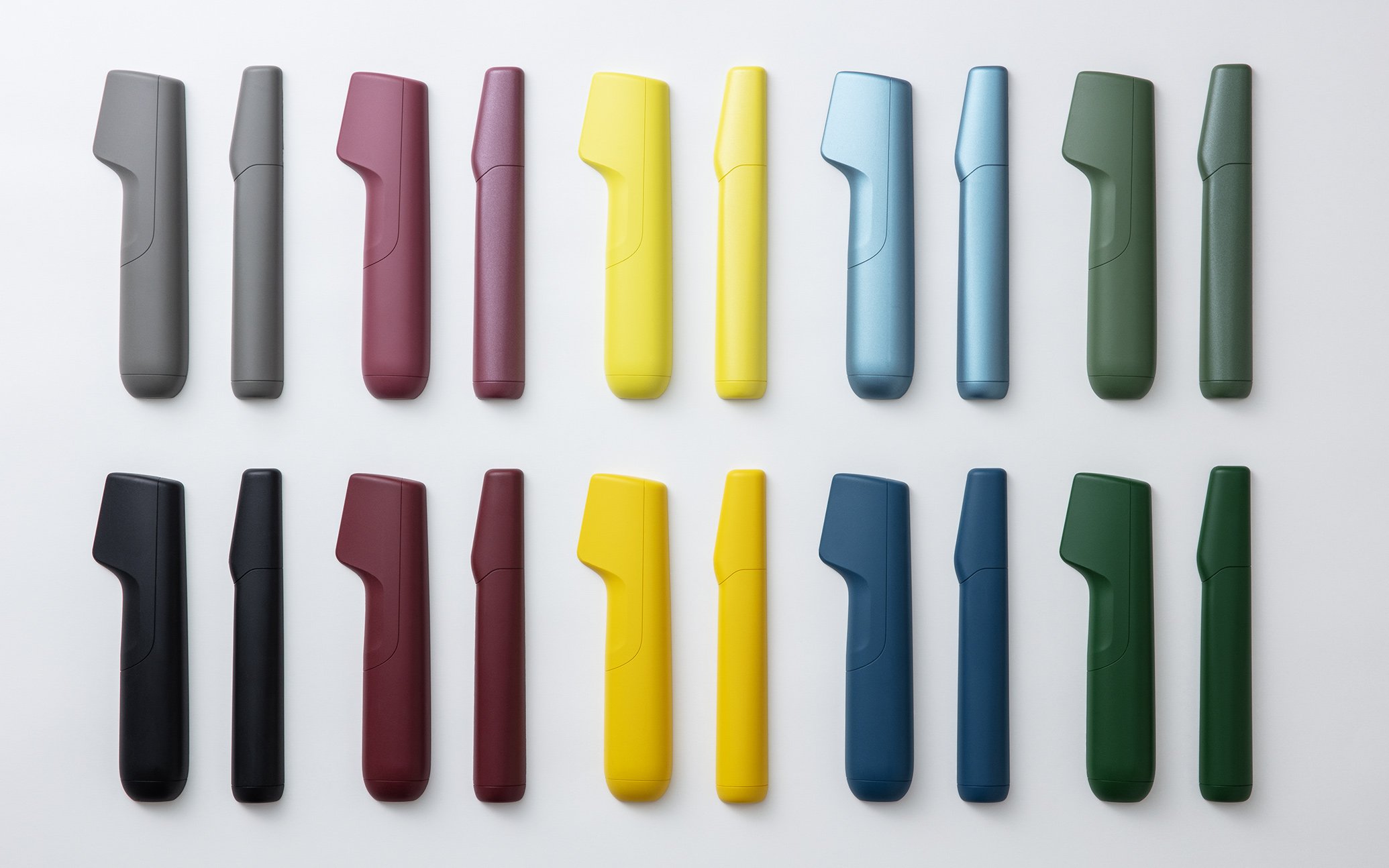 Image of electric trimmers in various colors and shapes, arranged in rows, including gray, pink, yellow, blue, and green