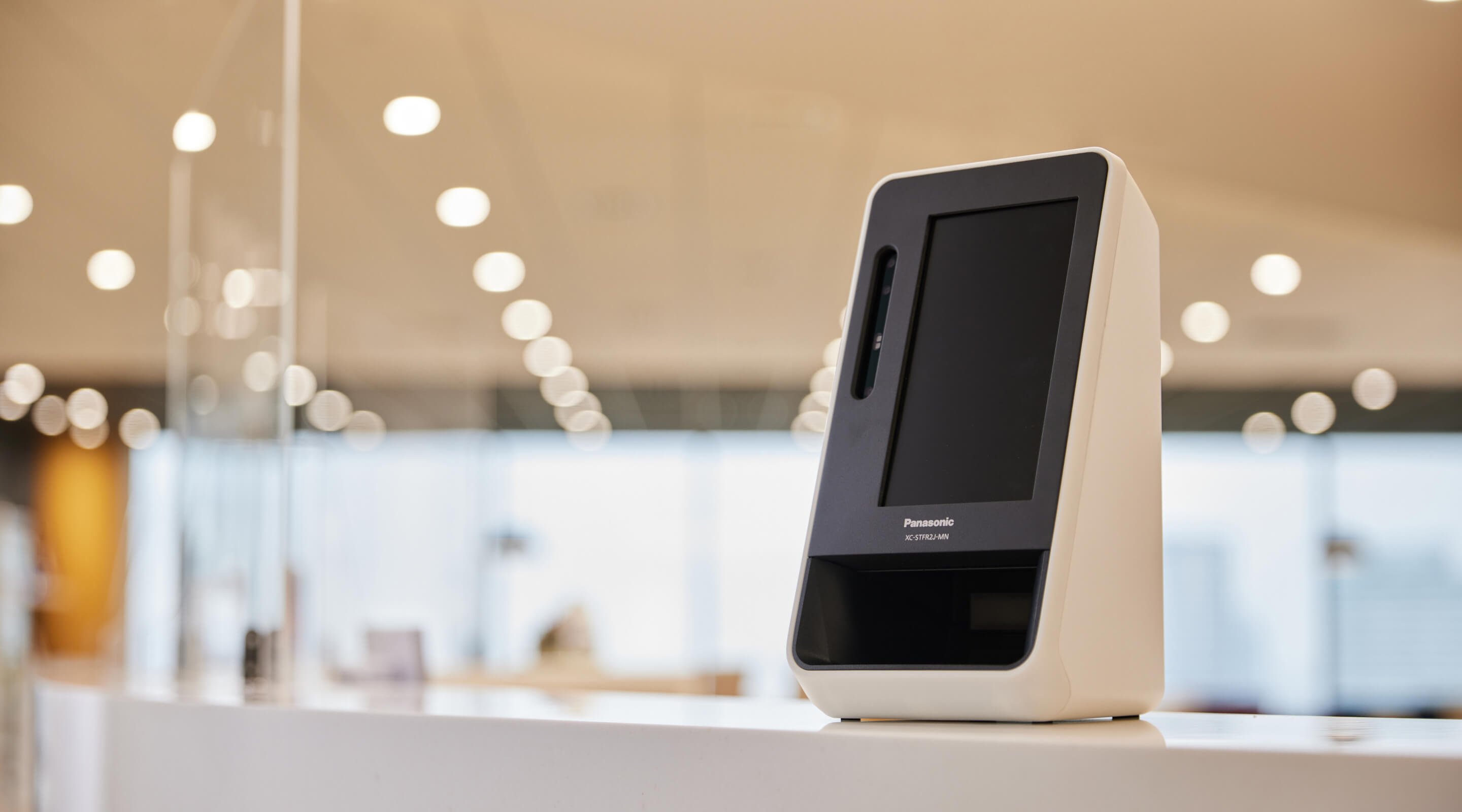 Facial recognition card reader on the counter.