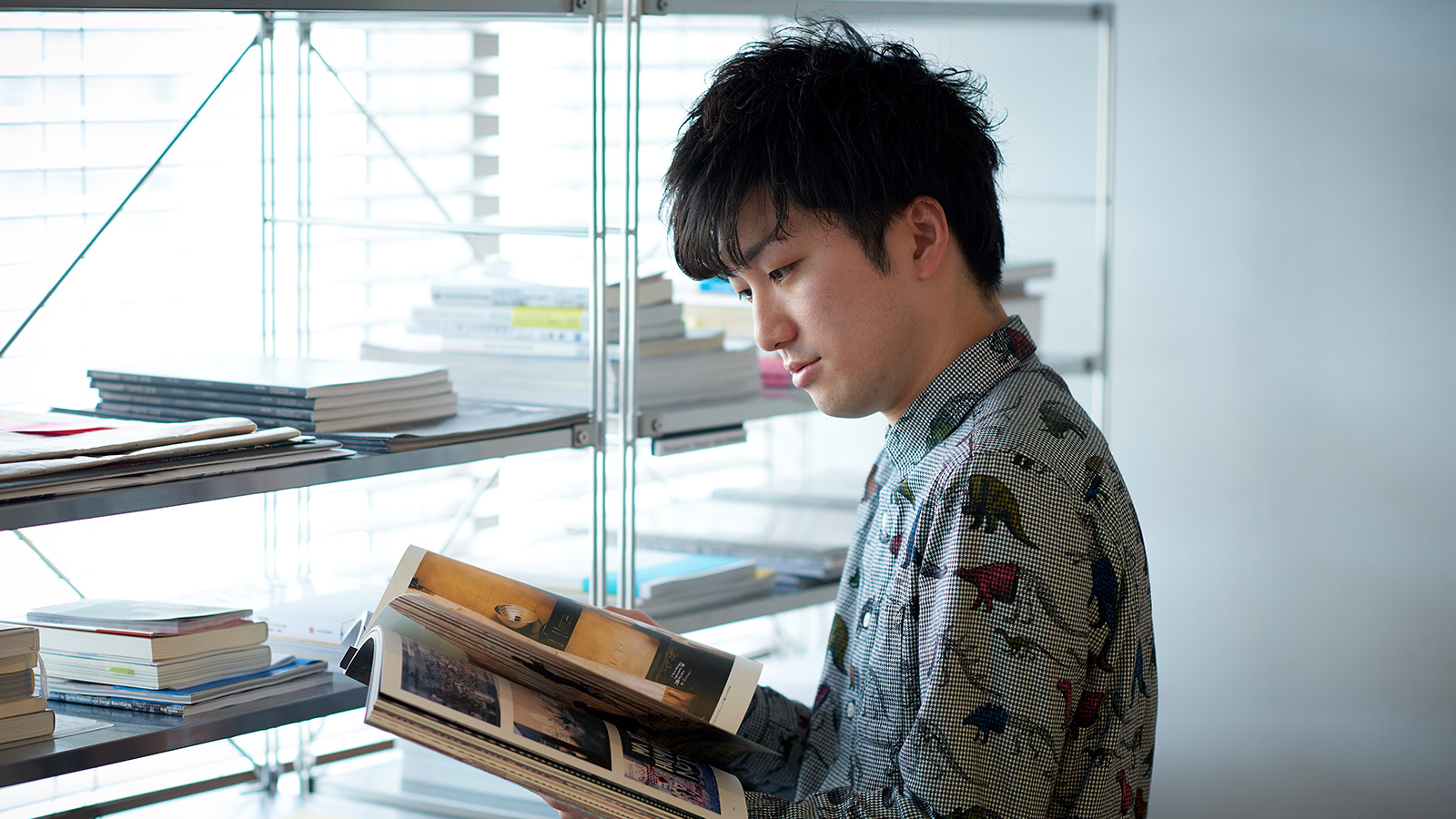 Photo: Kentaro Sako reading a book